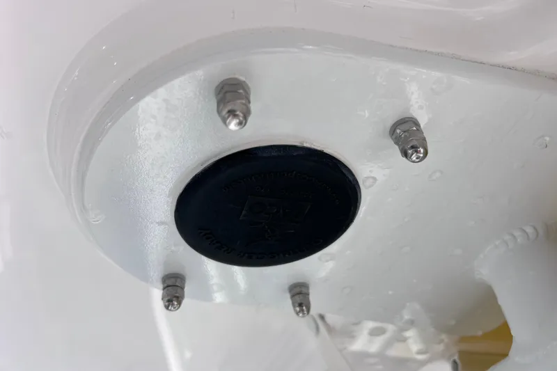 Slide: The Image of Close-up of 2024 Everglades 243 Center Console boat component with bolts and black cap. - 41