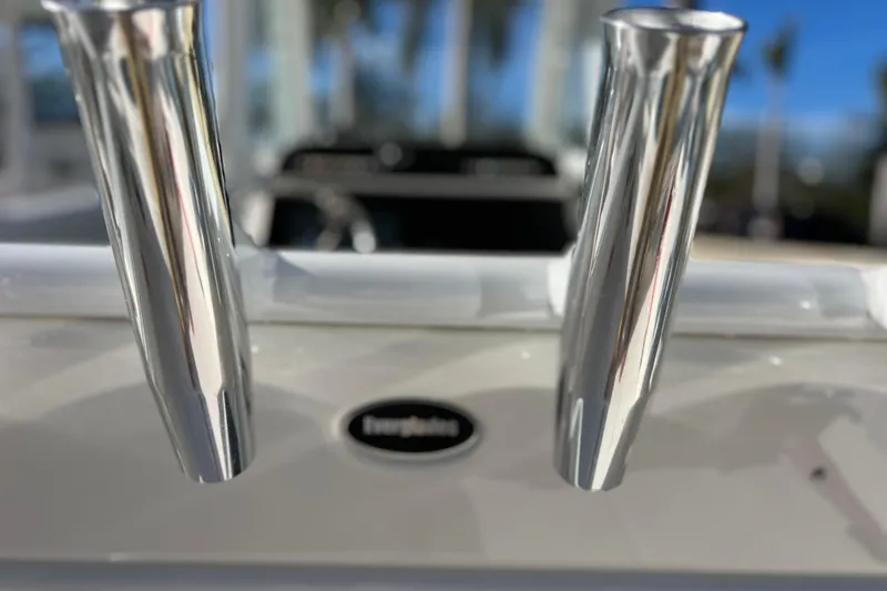 Slide: The Image of Close-up of 2024 Everglades 243 Center Console boat's polished metal rod holders. - 43
