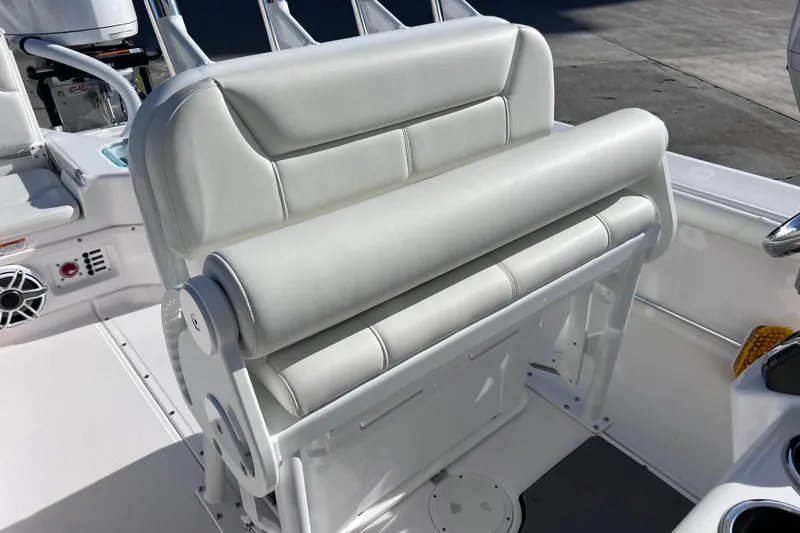 Slide: The Image of 2024 Everglades 243 Center Console boat interior with white cushioned seating. - 49