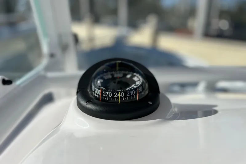 Slide: The Image of Compass on 2024 Everglades 243 Center Console boat dashboard. - 56
