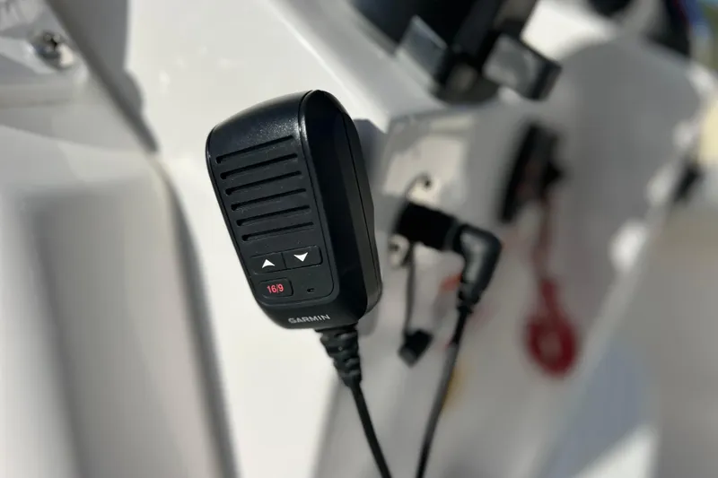 Slide: The Image of Close-up of a Garmin radio on a 2024 Everglades 243 Center Console boat. - 57