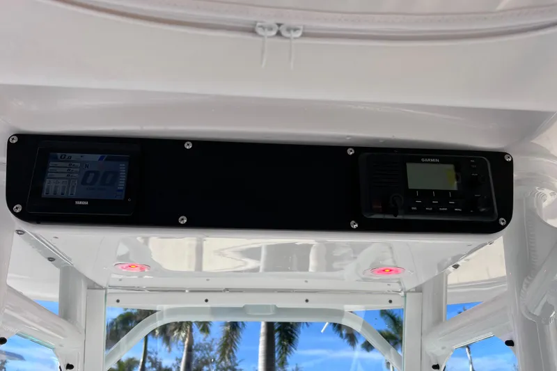 Slide: The Image of 2024 Everglades 243 Center Console dashboard with Yamaha and Garmin displays. - 58