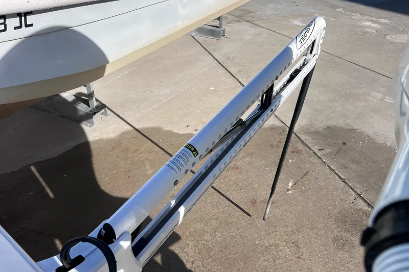 Slide: The Image of 2024 Everglades 243 Center Console boat detail on concrete surface. - 6