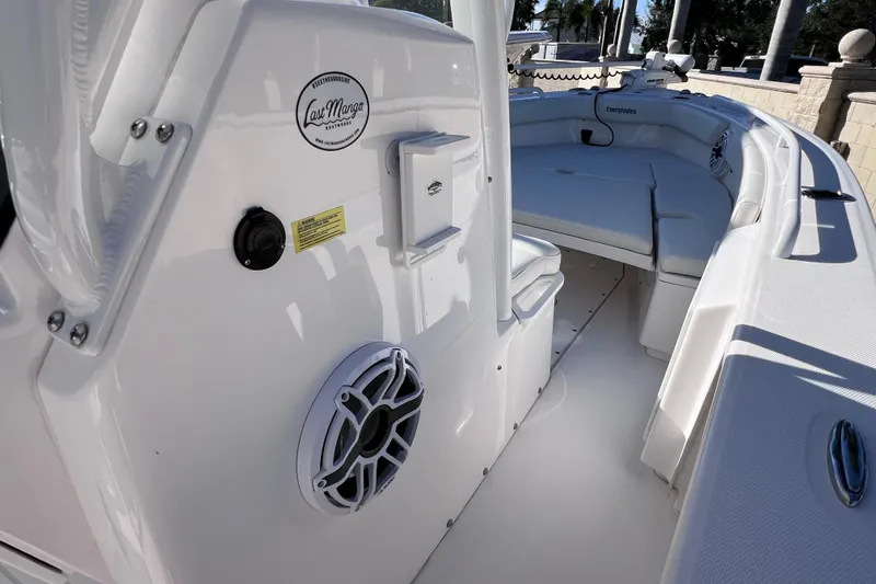 Slide: The Image of 2024 Everglades 243 Center Console boat interior with seating and speaker detail. - 64
