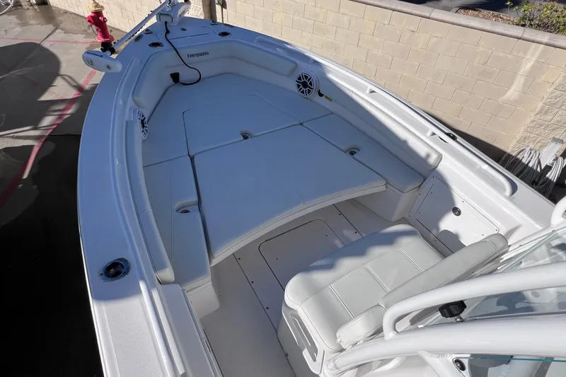 Slide: The Image of 2024 Everglades 243 Center Console boat interior with white seating and spacious deck. - 66