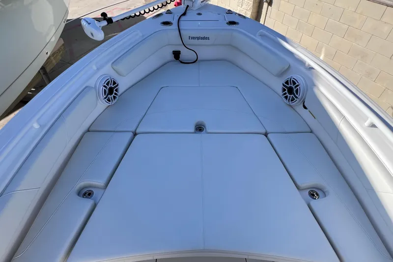 Slide: The Image of 2024 Everglades 243 Center Console boat interior with cushioned seating and speakers. - 69