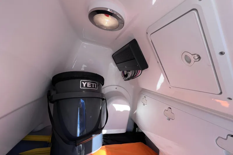 Slide: The Image of Interior of 2024 Everglades 243 Center Console boat with storage and equipment. - 75