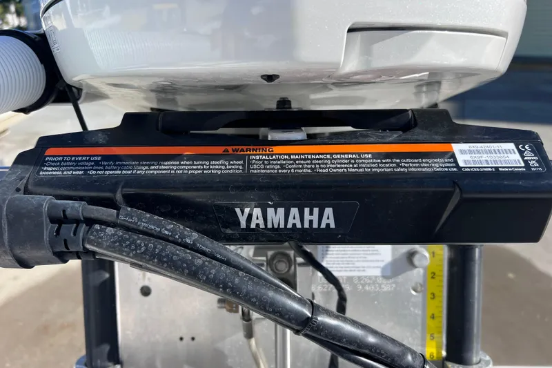Slide: The Image of Close-up of Yamaha engine on 2024 Everglades 243 Center Console boat. - 77