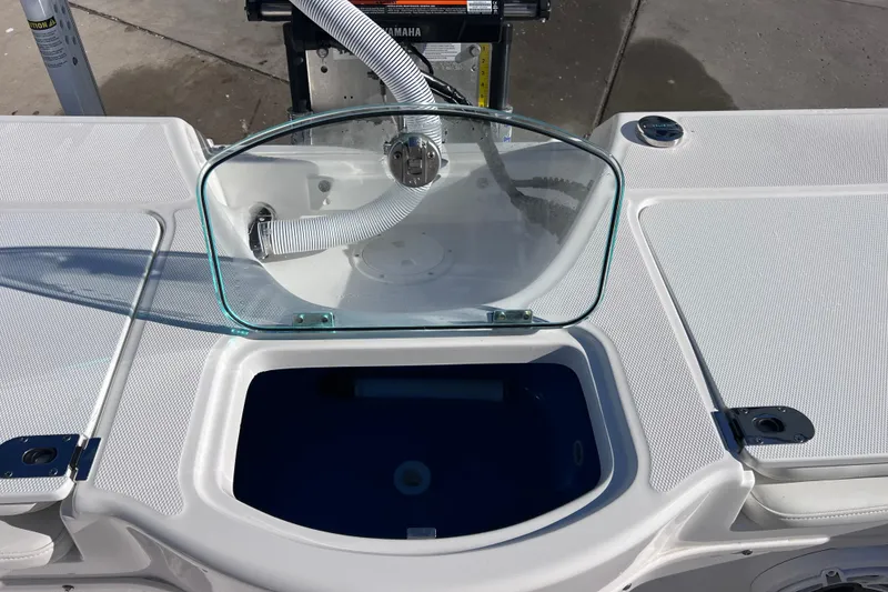 Slide: The Image of 2024 Everglades 243 Center Console boat with open livewell and glass cover. - 83