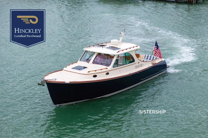 The Image of 2020 Hinckley Picnic Boat 34 MKII cruising on water, certified pre-owned. - 2