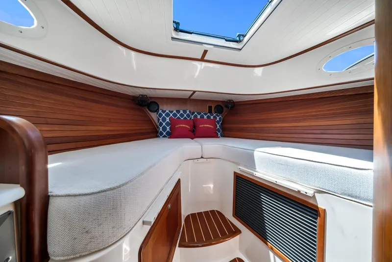 Slide: The Image of Interior of 2020 Hinckley Picnic Boat 34 MKII with cozy cabin and skylight. - 15