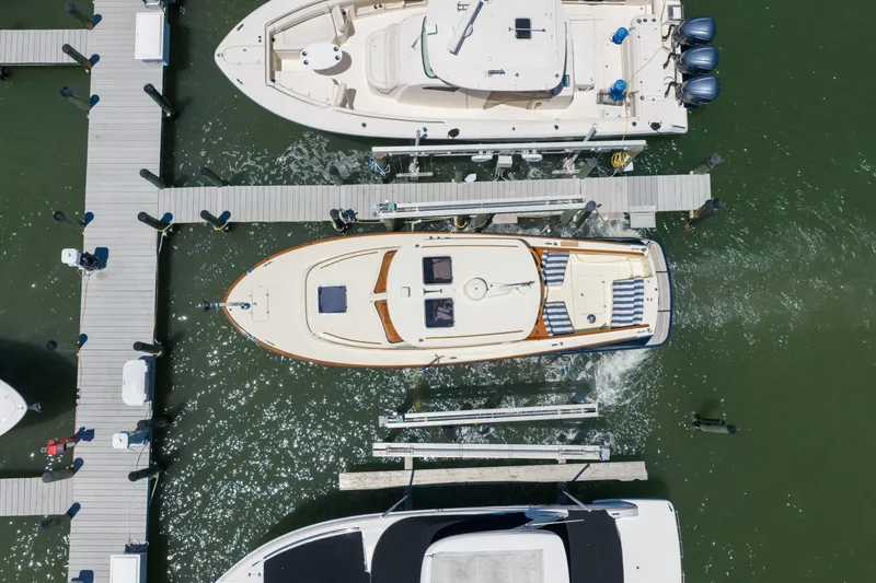 Slide: The Image of Aerial view of 2020 Hinckley Picnic Boat 34 MKII docked at marina. - 6
