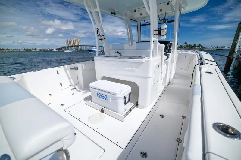 Slide: The Image of 2023 Robalo R302 Center Console boat interior with ocean view and cooler. - 17