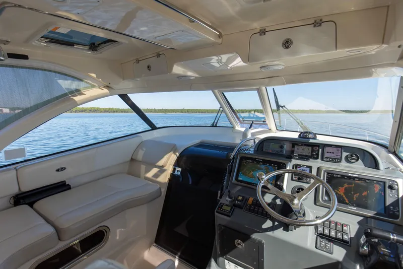 Slide: The Image of 2012 Pursuit 345 Offshore Helm, Hardtop, Windshield, Windshield Vent, Cabin Entryway and Companion Seating - 14