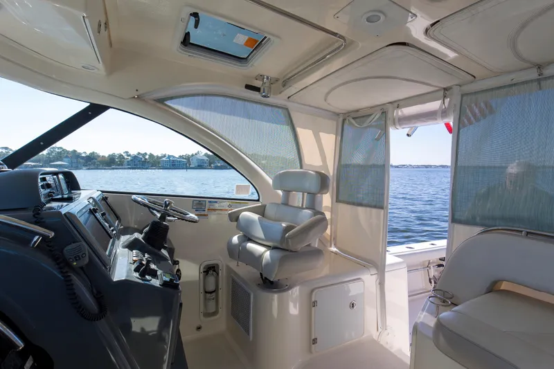 Slide: The Image of 2012 Pursuit 345 Offshore Helm, Hardtop, Overhead PFD Storage, Aft Enclosure - 15