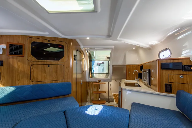 Slide: The Image of 2012 Pursuit 345 Offshore Cabin View looking aft from Convertible V-berth - 24