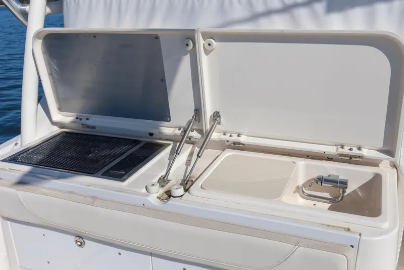Slide: The Image of 2012 Pursuit 345 Offshore Electric Grill, Sink and Cutting Board in Cockpit - 8