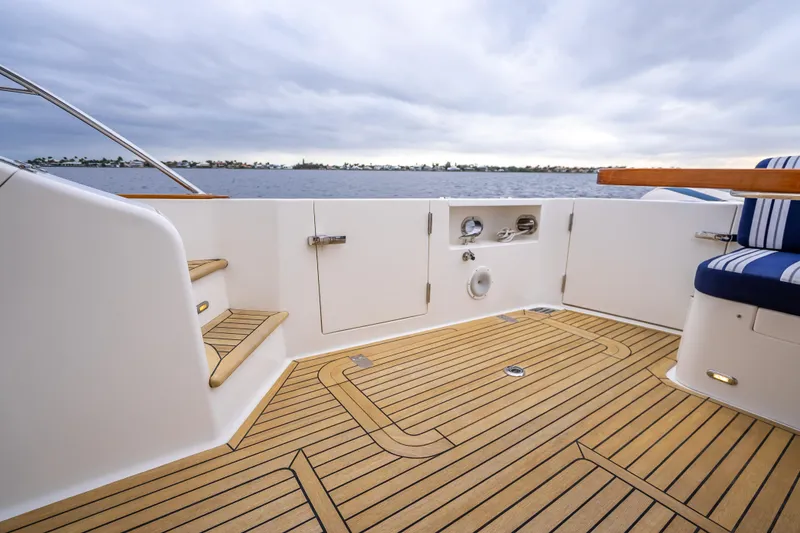 Slide: The Image of 2014 Grand Banks 50 Eastbay SX yacht deck with teak flooring and ocean view. - 17