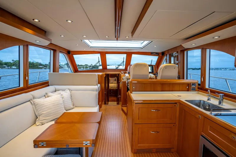 Slide: The Image of Luxurious interior of 2014 Grand Banks 50 Eastbay SX yacht with elegant wood finishes. - 2