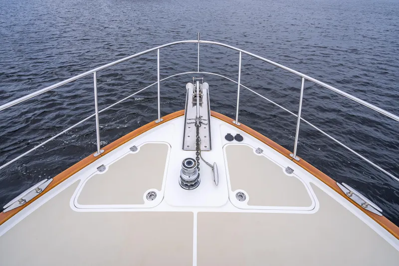 Slide: The Image of Bow view of 2014 Grand Banks 50 Eastbay SX yacht on open water. - 23