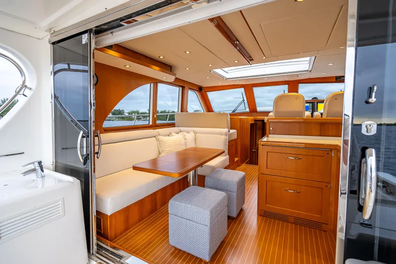 Slide: The Image of Luxurious interior of 2014 Grand Banks 50 Eastbay SX yacht with elegant wood finishes. - 26