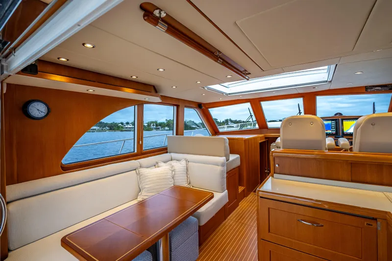 Slide: The Image of Luxurious interior of 2014 Grand Banks 50 Eastbay SX yacht with elegant wood finishes. - 30