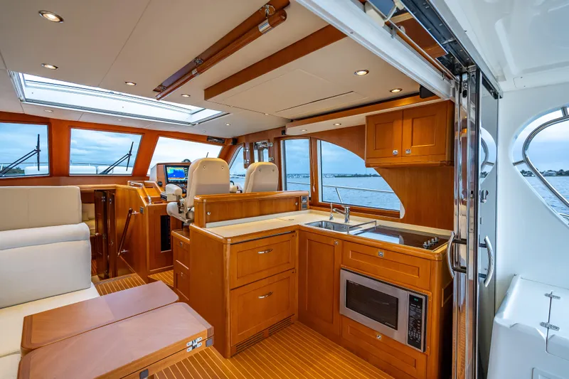 Slide: The Image of Luxurious interior of 2014 Grand Banks 50 Eastbay SX yacht with modern kitchen and helm. - 31
