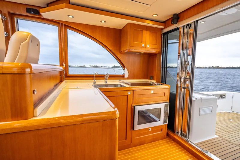 Slide: The Image of Luxurious 2014 Grand Banks 50 Eastbay SX yacht interior with modern kitchen and ocean view. - 35