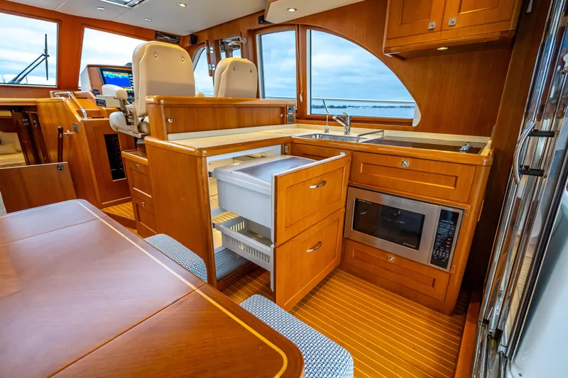 Slide: The Image of Luxurious 2014 Grand Banks 50 Eastbay SX yacht interior with modern kitchen amenities. - 37
