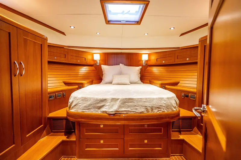 Slide: The Image of Luxurious cabin interior of 2014 Grand Banks 50 Eastbay SX yacht with wooden finishes. - 4