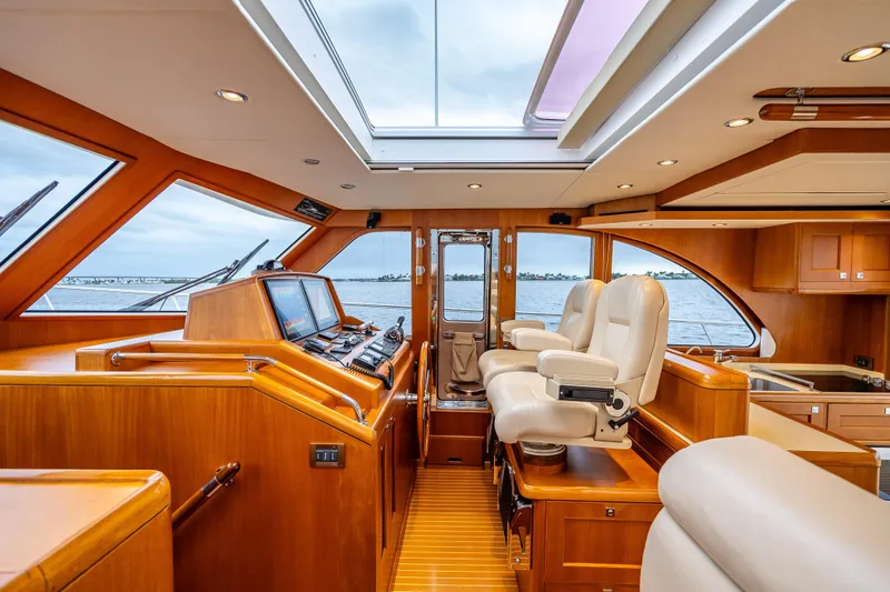 Slide: The Image of Luxurious interior of 2014 Grand Banks 50 Eastbay SX yacht with plush seating and navigation controls. - 41