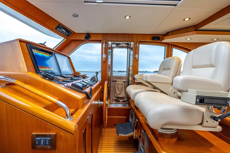 Slide: The Image of Luxurious helm of 2014 Grand Banks 50 Eastbay SX with leather seats and advanced navigation. - 42
