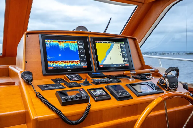Slide: The Image of 2014 Grand Banks 50 Eastbay SX helm with navigation displays and controls. - 46