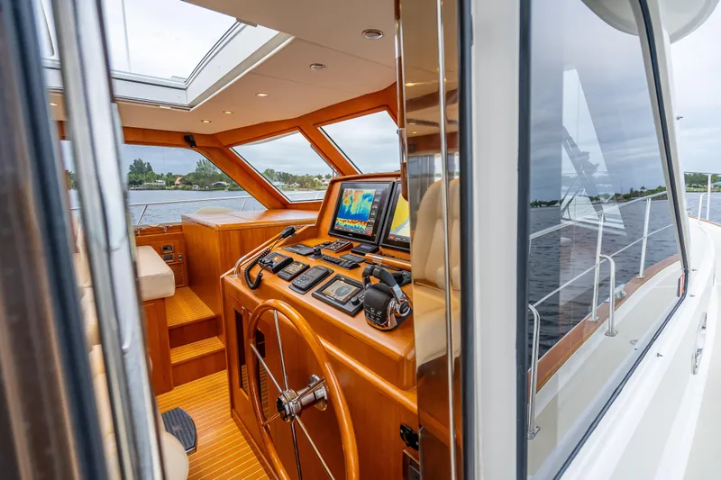Slide: The Image of Interior view of 2014 Grand Banks 50 Eastbay SX yacht helm station. - 49