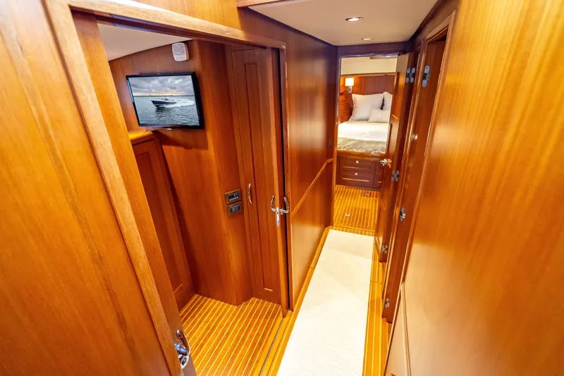 Slide: The Image of Luxurious wooden interior of 2014 Grand Banks 50 Eastbay SX yacht cabin hallway. - 50
