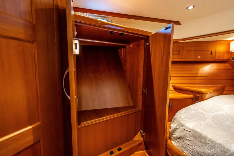 Slide: The Image of Luxurious wooden interior of 2014 Grand Banks 50 Eastbay SX yacht cabin. - 52