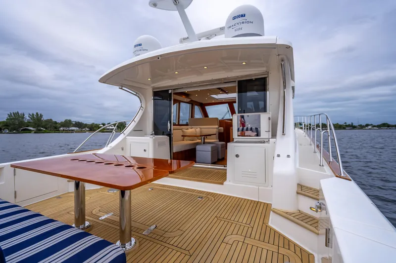Slide: The Image of 2014 Grand Banks 50 Eastbay SX yacht with elegant teak deck and luxurious interior. - 6