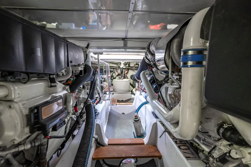 Slide: The Image of Engine room of 2014 Grand Banks 50 Eastbay SX yacht, showcasing mechanical components. - 66