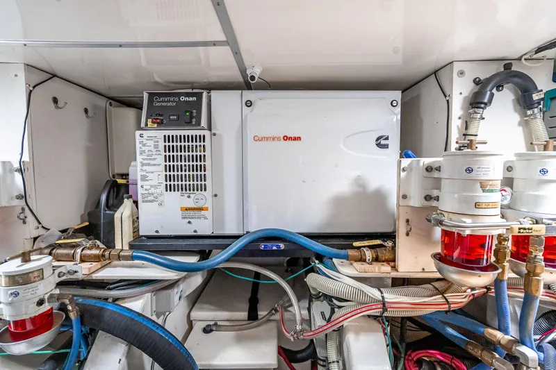 Slide: The Image of Engine room of 2014 Grand Banks 50 Eastbay SX with Cummins Onan generator. - 69