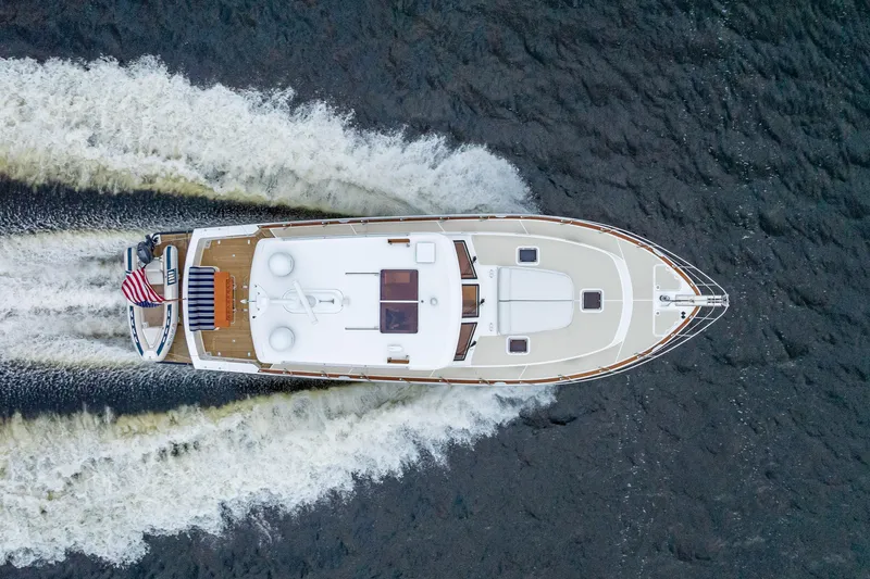 Slide: The Image of Aerial view of 2014 Grand Banks 50 Eastbay SX yacht cruising on water. - 73