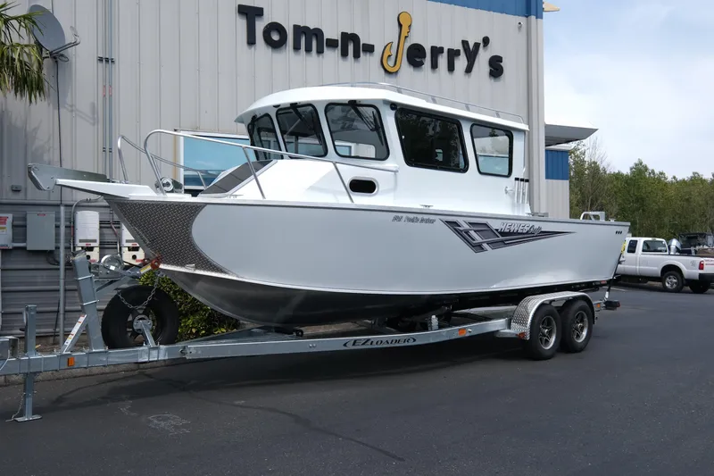 The Image of 2025 Hewescraft 240 Pacific Cruiser boat on trailer at dealership. - 1