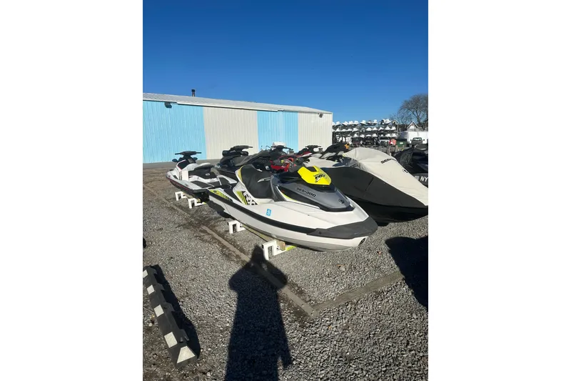 Slide: The Image of 2017 Sea-Doo RXT-X 300 jet ski parked outdoors on gravel. - 3