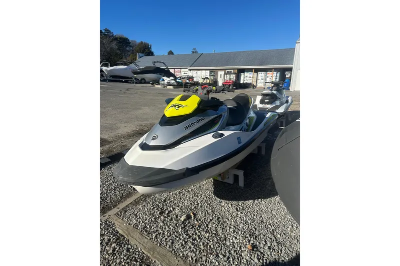 Slide: The Image of 2017 Sea-Doo RXT-X 300 jet ski parked outdoors on gravel. - 4