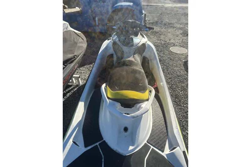 Slide: The Image of 2017 Sea-Doo RXT-X 300 jet ski parked on gravel surface. - 9