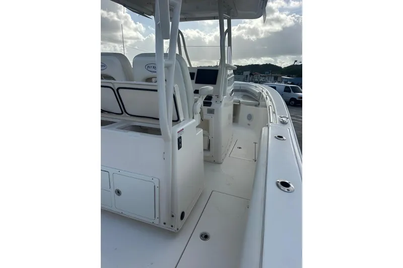 Slide: The Image of 2017 Cobia 296 Center Console boat interior with seating and control panel. - 25