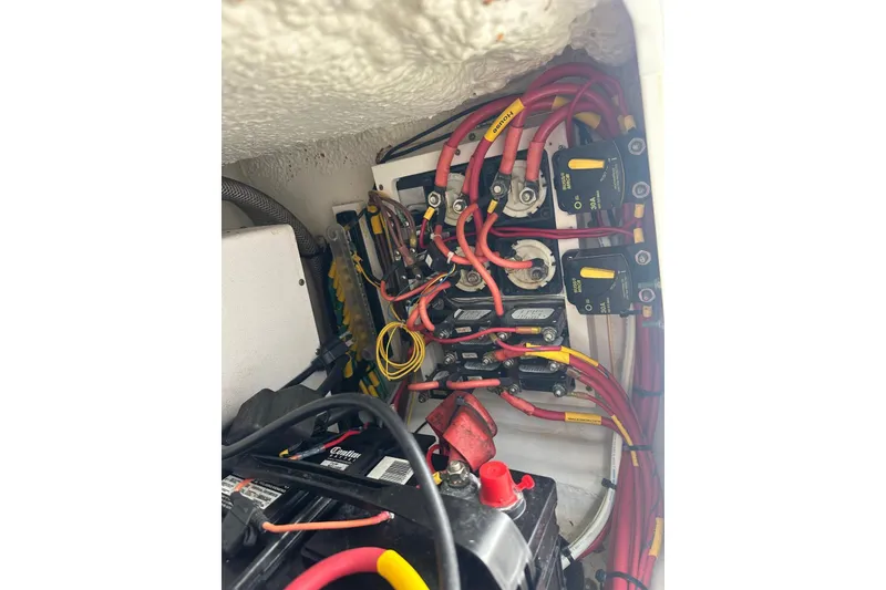 Slide: The Image of Electrical wiring and components inside a 2017 Cobia 296 Center Console boat. - 44