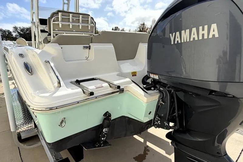 Slide: The Image of 2025 Key West 239 FS boat with Yamaha outboard motor, rear view. - 11