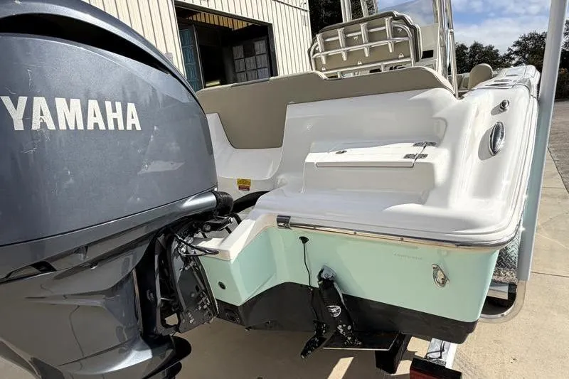Slide: The Image of 2025 Key West 239 FS boat with Yamaha engine, rear view in sunlight. - 12
