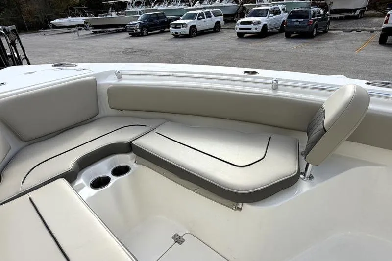 Slide: The Image of 2025 Key West 239 FS boat interior with cushioned seating and cup holders. - 17