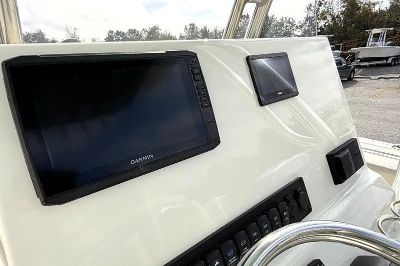 Slide: The Image of 2025 Key West 239 FS boat dashboard with Garmin navigation system. - 27
